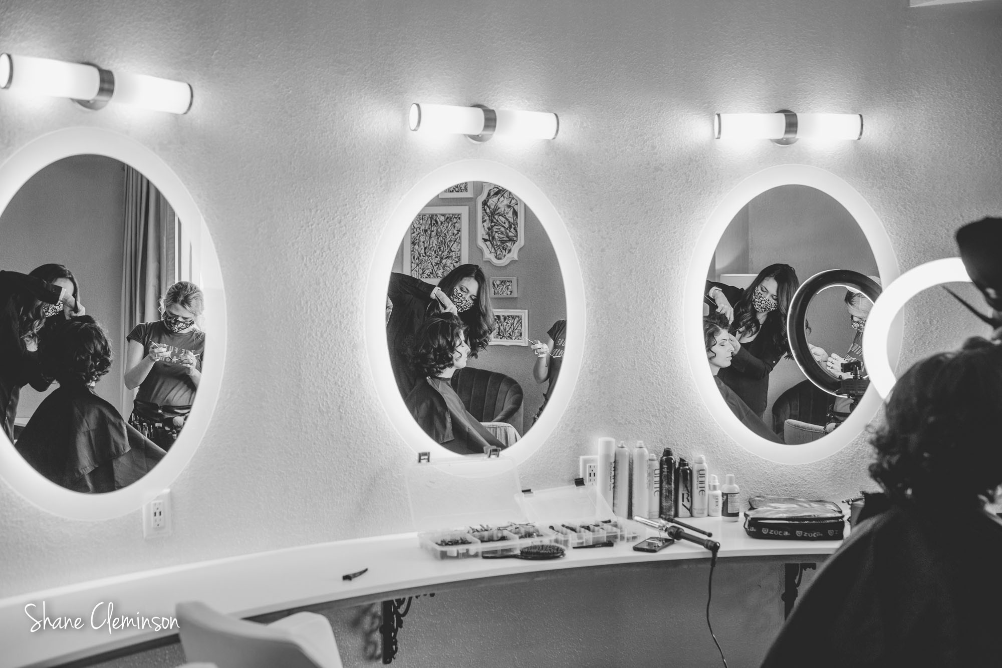Jay Marie Salon doing hair on a model.