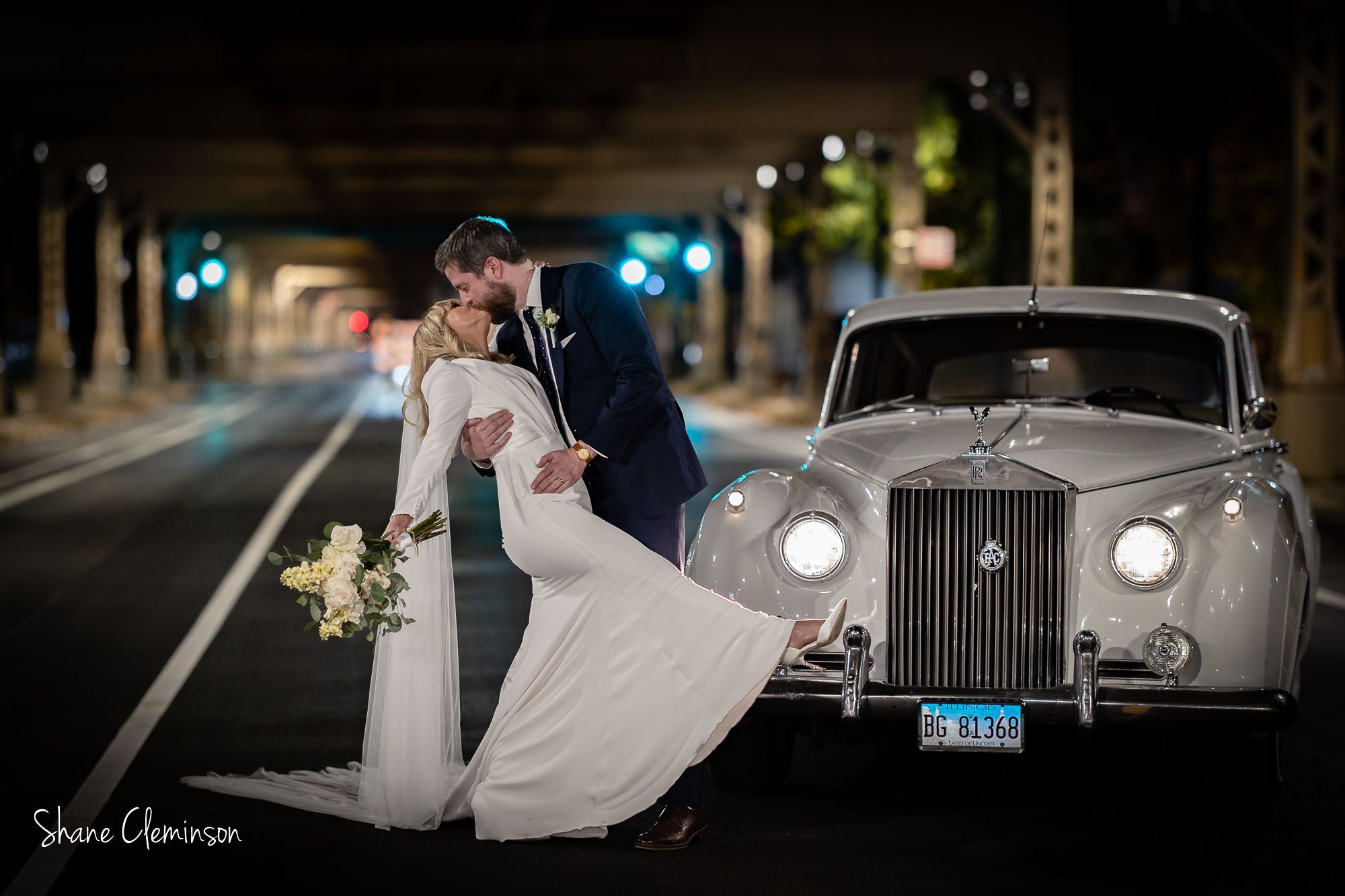 Ovation Wedding Venue by Chicago Wedding Photographer Shane Cleminson. Couple with a Rolls Royce.